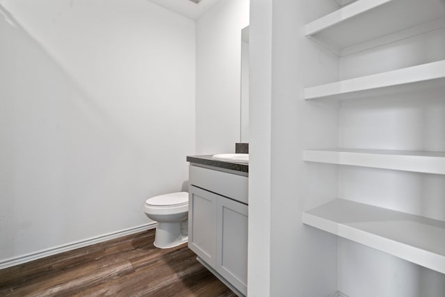 5115 Belmont Hill Ct, Spring, TX 77373 - bathroom featuring wood finished floors, toilet, and vanity