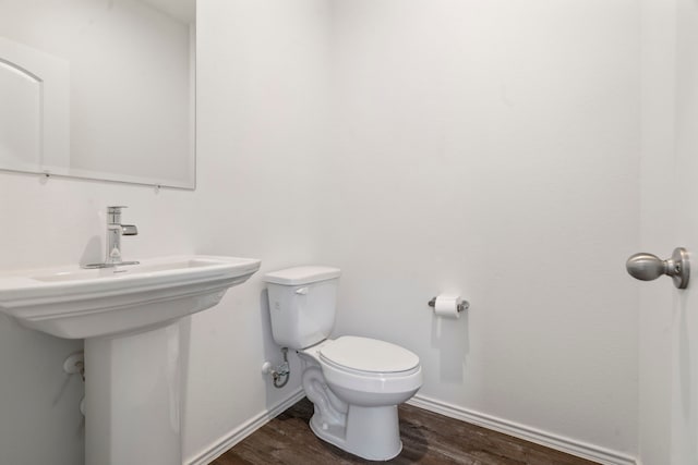 5115 Belmont Hill Ct, Spring, TX 77373 - bathroom featuring toilet, wood finished floors, baseboards, and a sink