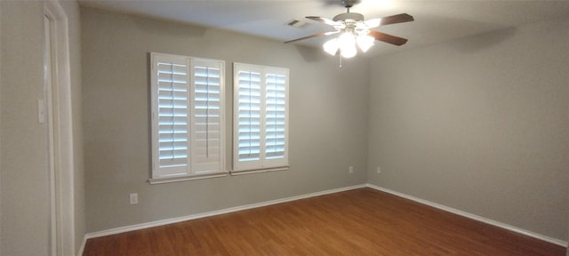 2518 Skyview Cove Ct, Houston, TX 77047 - spare room with wood finished floors, ceiling fan, and baseboards