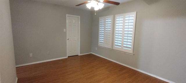 2518 Skyview Cove Ct, Houston, TX 77047 - spare room featuring a ceiling fan, wood finished floors, and baseboards