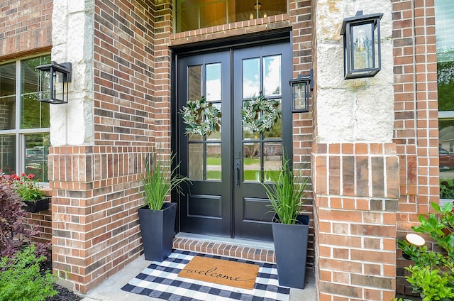 4511 Wickby St, Fulshear, TX 77441 - property entrance featuring french doors and brick siding