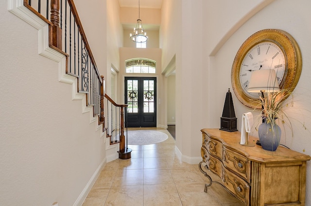 4511 Wickby St, Fulshear, TX 77441 - foyer featuring stairs, a high ceiling, and a chandelier