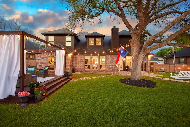 4511 Wickby St, Fulshear, TX 77441 - back of house featuring a chimney, a deck, and brick siding