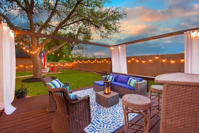 4511 Wickby St, Fulshear, TX 77441 - fenced backyard featuring a wooden deck and an outdoor hangout area