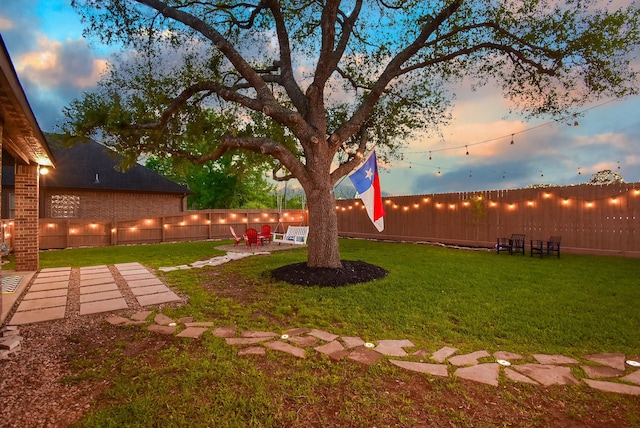 4511 Wickby St, Fulshear, TX 77441 - fenced backyard featuring a patio area