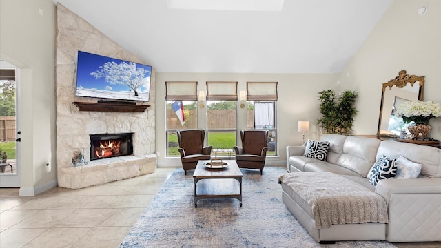 4511 Wickby St, Fulshear, TX 77441 - living room with lofted ceiling, plenty of natural light, a fireplace, and tile patterned floors