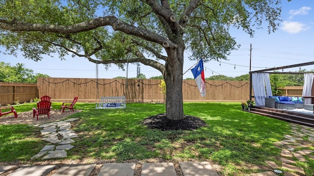 4511 Wickby St, Fulshear, TX 77441 - fenced backyard with an outdoor living space with a fire pit