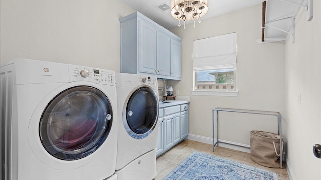 4511 Wickby St, Fulshear, TX 77441 - laundry area with separate washer and dryer, cabinet space, a chandelier, and light tile patterned floors