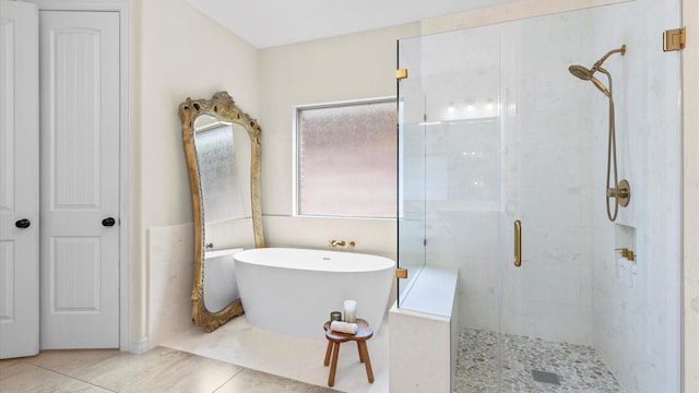 4511 Wickby St, Fulshear, TX 77441 - bathroom featuring plenty of natural light, a shower stall, a freestanding bath, and tile patterned flooring