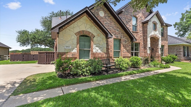 4511 Wickby St, Fulshear, TX 77441 - view of front of home with stone siding and brick siding