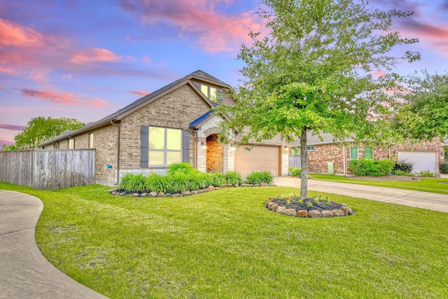 27727 Gracefield Ln, Fulshear, TX 77441 - view of front of house with brick siding, concrete driveway, and an attached garage