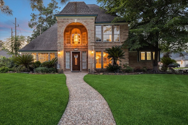 5718 Glenmere Ln, Spring, TX 77379 - view of front of house with brick siding and a front lawn