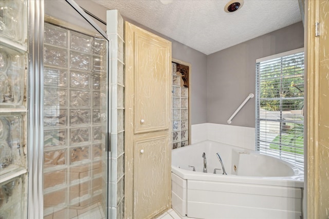 5718 Glenmere Ln, Spring, TX 77379 - full bathroom with a whirlpool tub, a textured ceiling, and walk in shower
