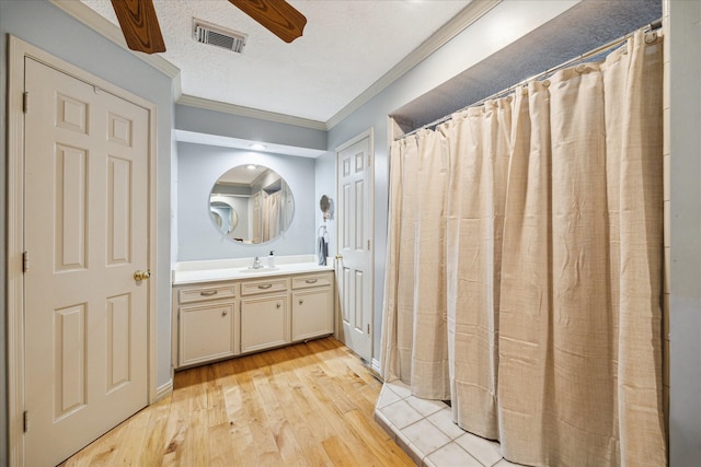 5718 Glenmere Ln, Spring, TX 77379 - full bathroom featuring crown molding, wood finished floors, vanity, and ceiling fan