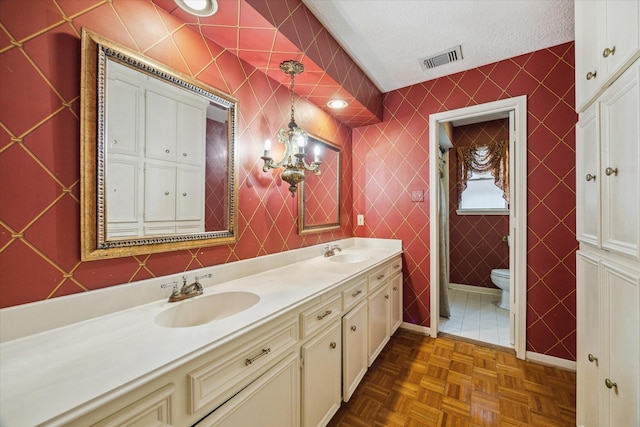 5718 Glenmere Ln, Spring, TX 77379 - bathroom featuring double vanity and a textured ceiling