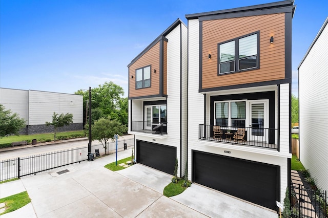 4013 Griggs Rd Unit H, Houston, TX 77021 - contemporary house featuring an attached garage, driveway, and a balcony