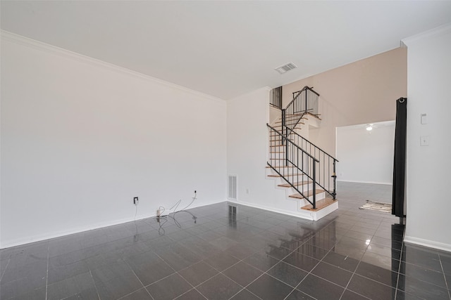 5722 Henniker Dr, Houston, TX 77041 - unfurnished living room with dark tile patterned floors, stairs, baseboards, and ornamental molding