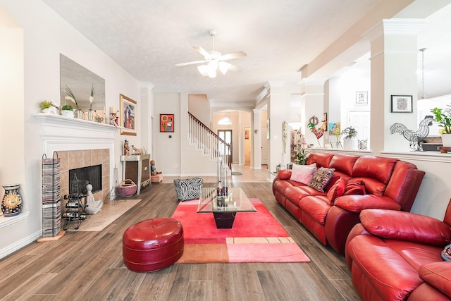 2 Camborn Pl, The Woodlands, TX 77384 - living room with ceiling fan, wood finished floors, a fireplace, and stairs