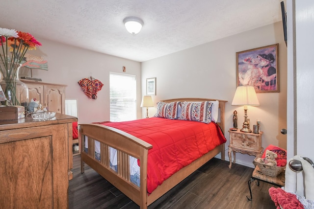 2 Camborn Pl, The Woodlands, TX 77384 - bedroom featuring dark wood-style flooring and a textured ceiling
