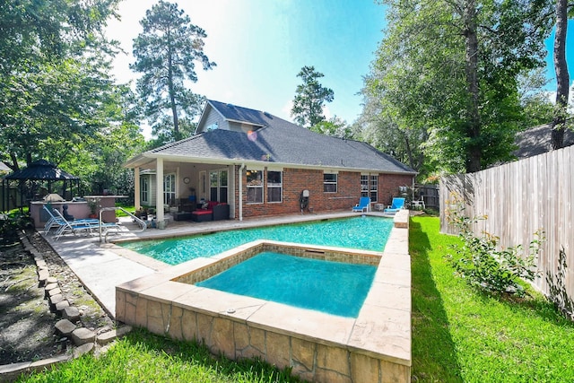 2 Camborn Pl, The Woodlands, TX 77384 - view of swimming pool featuring a gazebo, a hot tub, a fenced backyard, a patio area, and an outdoor hangout area