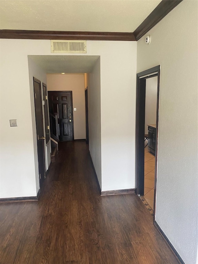 1201 Mcduffie St Unit 122, Houston, TX 77019 - hallway with crown molding and wood finished floors