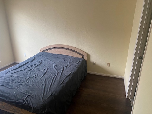 1201 Mcduffie St Unit 122, Houston, TX 77019 - bedroom with dark wood finished floors and baseboards