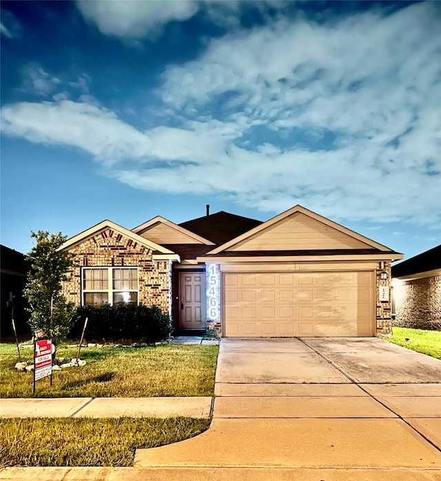 15466 Sicomoro Viejo St, Channelview, TX 77530 - ranch-style home featuring a garage, driveway, and brick siding
