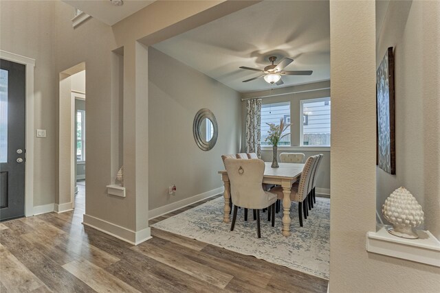 127 Kingsley Grove St, Montgomery, TX 77316 - dining room featuring wood finished floors, a ceiling fan, and baseboards