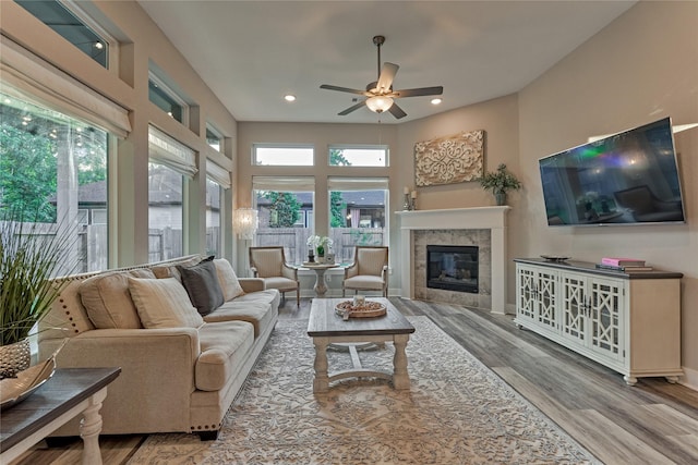 127 Kingsley Grove St, Montgomery, TX 77316 - living area featuring wood finished floors, ceiling fan, a tile fireplace, and recessed lighting