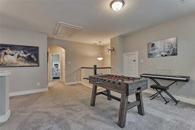 127 Kingsley Grove St, Montgomery, TX 77316 - playroom with attic access, carpet flooring, arched walkways, and baseboards
