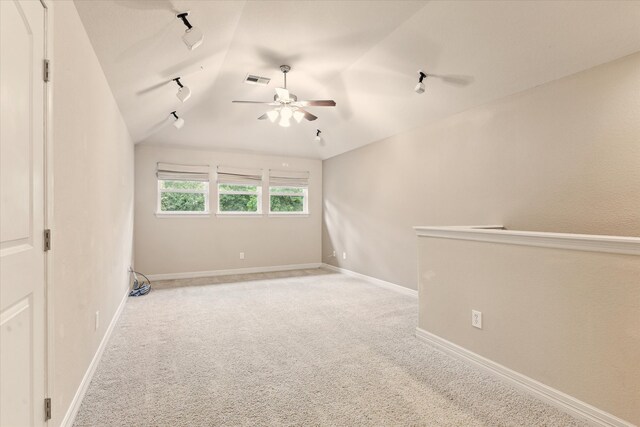 28314 Shining Creek Ln, Spring, TX 77386 - carpeted spare room featuring a ceiling fan, vaulted ceiling, track lighting, and baseboards