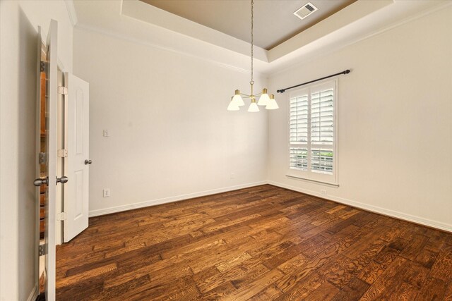 28314 Shining Creek Ln, Spring, TX 77386 - empty room with a chandelier, a tray ceiling, dark wood-type flooring, and baseboards