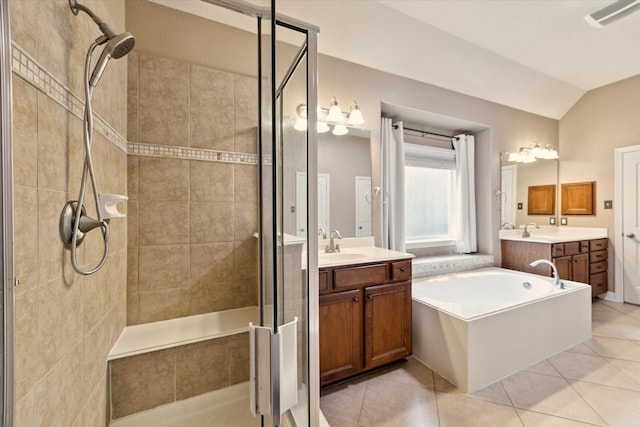 28314 Shining Creek Ln, Spring, TX 77386 - full bathroom with a shower stall, a garden tub, two vanities, and lofted ceiling