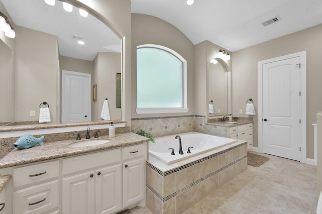 11415 W Kristina Cir, Montgomery, TX 77316 - bathroom featuring two vanities and a bath