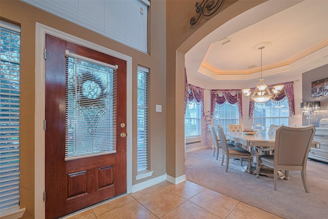 7207 Alder Springs Ct, Katy, TX 77494 - entryway featuring light colored carpet, a chandelier, light tile patterned floors, and plenty of natural light