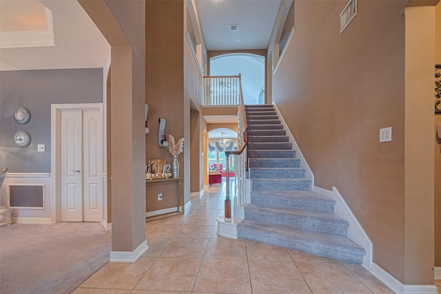 7207 Alder Springs Ct, Katy, TX 77494 - staircase featuring tile patterned floors, baseboards, and carpet
