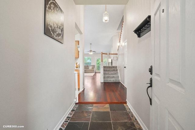 647 Cypresswood Trce, Spring, TX 77373 - foyer entrance with stone tile floors, baseboards, a ceiling fan, and stairway
