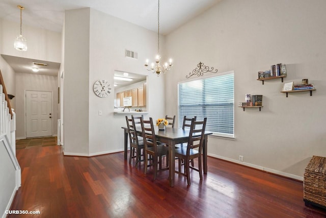 647 Cypresswood Trce, Spring, TX 77373 - dining space with wood finished floors, baseboards, a chandelier, and a high ceiling