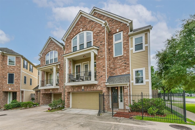 1513 Nagle St, Houston, TX 77003 - view of front of property with a balcony, an attached garage, brick siding, and driveway