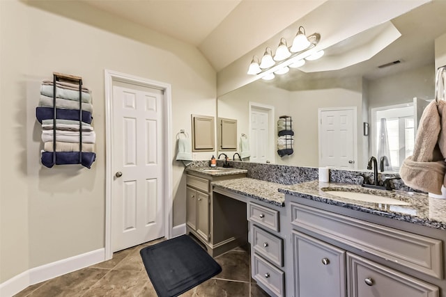 1513 Nagle St, Houston, TX 77003 - bathroom with double vanity, vaulted ceiling, and tile patterned flooring