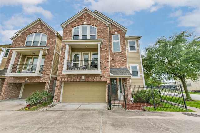 1513 Nagle St, Houston, TX 77003 - view of front of home with an attached garage, driveway, brick siding, and a balcony