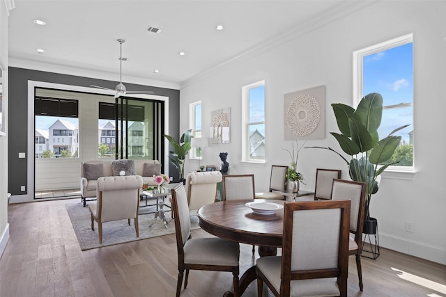 8711 Park Kolbe Ln, Houston, TX 77080 - dining room with wood finished floors, ornamental molding, baseboards, recessed lighting, and ceiling fan