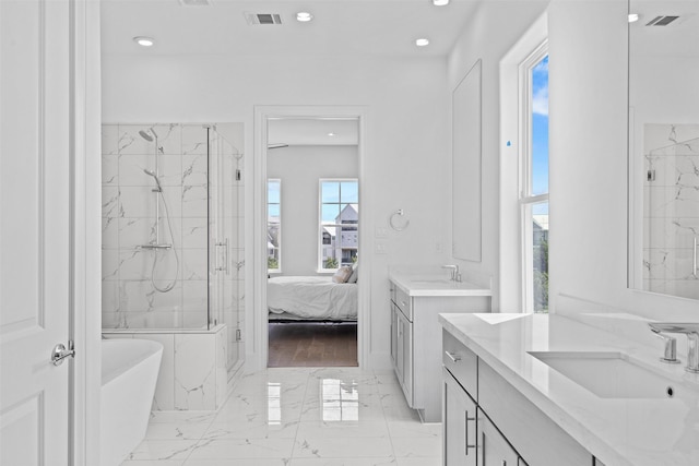 8711 Park Kolbe Ln, Houston, TX 77080 - ensuite bathroom featuring marble finish floors, a marble finish shower, a soaking tub, recessed lighting, and two vanities