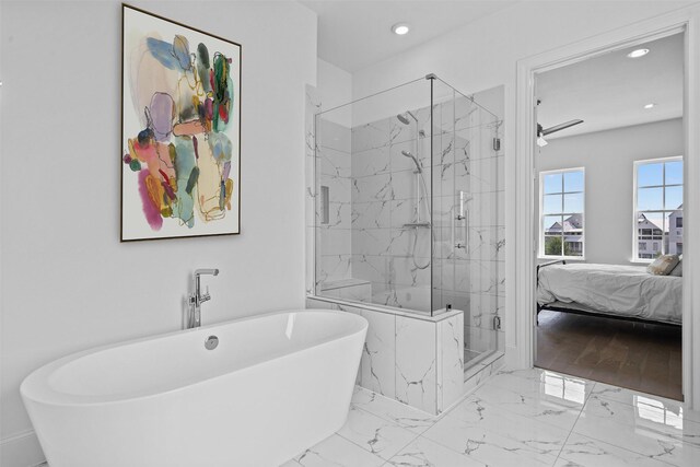 8711 Park Kolbe Ln, Houston, TX 77080 - bathroom with a freestanding tub, a marble finish shower, ensuite bathroom, recessed lighting, and marble finish floors