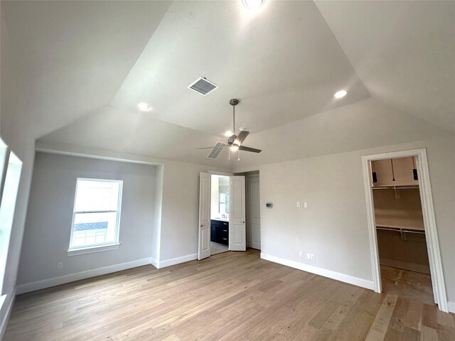 2620 Lake Kolbe Ln, Houston, TX 77080 - unfurnished bedroom with lofted ceiling, multiple windows, baseboards, light wood finished floors, and recessed lighting