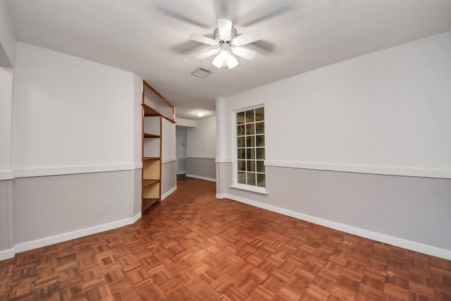 1409 N Park Ridge Dr, Deer Park, TX 77536 - unfurnished room featuring a ceiling fan, baseboards, and a textured ceiling