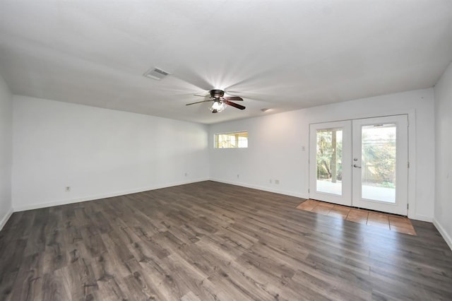 1409 N Park Ridge Dr, Deer Park, TX 77536 - spare room featuring a ceiling fan, dark wood finished floors, french doors, and baseboards