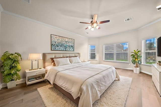 1111 White Winter Ct, Richmond, TX 77406 - bedroom featuring light wood-style floors, crown molding, baseboards, and a ceiling fan