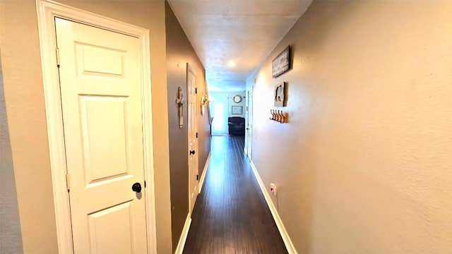 18042 Noble Forest Dr, Humble, TX 77346 - corridor with dark wood-style flooring and baseboards