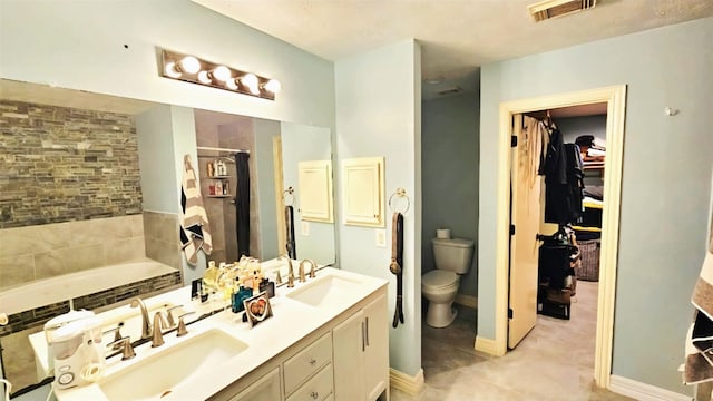 18042 Noble Forest Dr, Humble, TX 77346 - full bathroom featuring double vanity, a garden tub, a spacious closet, and curtained shower